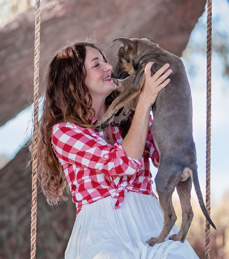Caitlin holding a dog